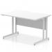 The picture shows a modern and sleek Dynamic Rectangle Desk with Impulse 1200 x 800mm dimensions. It has a scalloped edge and a white top that contrasts with the silver cantilever leg. The desk exudes professionalism, making it a great addition to any office.