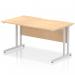 This photo shows a dynamic rectangular desk with an Impulse 1400 x 800mm scalloped edge and a straight office desk with a maple top. The desk is supported by a silver cantilever leg, providing a sleek and modern look.