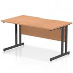 This picture shows a modern office desk with a scalloped edge and an oak top. The desk is rectangular and measures 1400 x 800mm. It features sleek black cantilever legs for stability and a dynamic, professional look.