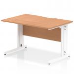 The image shows a sleek and modern office desk in oak and white, measuring 1200 x 800mm. The desk has a scalloped edge and is equipped with cable management for a tidy workspace. Its legs are also cable managed for a seamless look.
