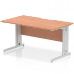 The picture shows a sleek, modern office desk with a beech wood top and silver cable managed legs. The scalloped edge adds a touch of elegance, while the dynamic design allows for efficient cable management.