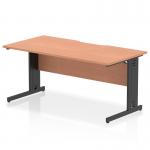 The Dynamic Cable Managed Desks Impulse features a sleek beech top with a scalloped edge for a modern touch. The black cable managed leg keeps cords organized for a clean workspace. Measuring 1600 x 800mm, this straight office desk is both functional and stylish.