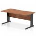 The photograph captures a sleek, modern office desk with a scalloped edge and a walnut top. A black cable managed leg adds a touch of sophistication. The cables are neatly organized, highlighting the desks functional design. Perfect for any dynamic workspace.