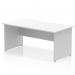 The photo shows a sleek white office desk with a scalloped edge and panel end legs. The desk is 1600 x 800mm in size and has a dynamic and modern design. Its streamlined appearance is perfect for any office space.