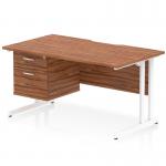 This photo shows a sleek and functional dynamic pedestal desk measuring 1400 x 800mm. It has a scalloped edge walnut top and a white cantilever leg, creating a modern and stylish workstation. There is also a 2 drawer fixed pedestal for added storage.