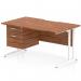 This photo shows a sleek and functional dynamic pedestal desk measuring 1400 x 800mm. It has a scalloped edge walnut top and a white cantilever leg, creating a modern and stylish workstation. There is also a 2 drawer fixed pedestal for added storage.