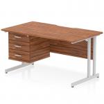 This photo shows a 1400 x 800mm dynamic pedestal desk with a scalloped edge and walnut top. The silver cantilever leg adds stability and style to the workstation. Included is a fixed pedestal with 3 drawers for storage. Perfect for any office setting.