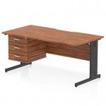 The dynamic pedestal desk has a sleek, walnut top with a scalloped edge and a black cable-managed leg. It also includes a fixed pedestal with three drawers for storage. Perfect for any modern office space.