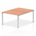 The photo shows a modern and functional Dynamic Bench Desking Impulse Bench B2B, designed for two people with a sleek silver frame and a stylish beech finish. The clean and organized design of this office bench desk provides an efficient workspace for any business setting.