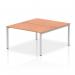 The picture shows a modern and sleek desk featuring two workstations side by side. Its silver frame adds a dynamic touch while the beech wood desk adds a warm element. This bench desk is ideal for a collaborative and efficient office space.
