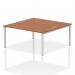 The image displays a modern, silver-framed bench desk designed for two people. The desk features a sleek and functional design with a walnut top, perfect for a contemporary office space.