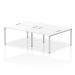 This photo shows a sleek and modern Dynamic Bench Desking Impulse Bench B2B, featuring a 4 person layout with a silver frame and a white office bench desk. Perfect for a dynamic and collaborative work environment.