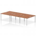 The dynamic bench desking, Impulse Bench B2B, is a sleek and modern office bench desk that can accommodate up to 6 people. It features a silver frame and a walnut finish top, offering a stylish and contemporary look. This functional and ergonomic design is perfect for any modern office setting.