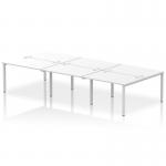 A stunning modern office space is captured in this photograph, featuring a sleek and stylish dynamic bench desking setup. The Impulse Bench B2B comfortably accommodates 6 persons and stands on a sturdy silver frame. Crisp white desktops add a touch of brightness to the overall design.