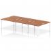 This photograph captures a sleek and modern design, featuring a dynamic bench desk with a white frame and a walnut finish. The spacious 6-person setup allows for collaborative working, while the clean lines and minimalist look add a touch of sophistication to any office space.