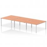 This image shows a dynamic bench desking setup with an Impulse Bench B2B 6 person configuration. The desk has a sleek silver frame and is made of beech wood. Perfect for creating a productive office space.