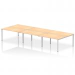 This picture shows a modern and versatile workspace with a 6-person Dynamic Bench Desking Impulse Bench B2B. Its sleek silver frame and maple desk top create a professional and inviting atmosphere for any office.