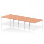 This picture shows a sleek and modern office setup featuring a dynamic bench desking system. The six-person bench desk has a white frame and is paired with a stylish beech desktop. The design is perfect for a collaborative and functional workspace.