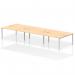 This photograph showcases a modern office space with a sleek and functional Dynamic Bench Desking Impulse Bench B2B desk setup. The 6-person desk features a silver frame and a maple wood finish, creating a contemporary and professional look.