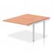 In the photo, you can see a sleek and modern bench desk with a silver frame and a warm beech tabletop. Its dynamic design and added extensions make it perfect for the office environment. The focal point of any B2B interaction, this desk is sure to impress.