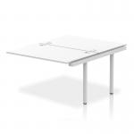 The photograph captures a sleek, modern bench desk that boasts a silver frame and white top. The dynamic design allows for flexibility and collaboration, making it a practical choice for any office setting. The spacious 1200 size provides ample workspace, while the Impulse Bench B2B Ext Kit adds an extra touch of functionality. The overall look exudes professionalism and sophistication.
