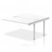 This image features a sleek and modern dynamic bench desking setup, including an impulse bench with a B2B extended kit and a silver frame. The office bench desk is a pristine white color, with a total length of 1400mm.