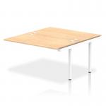 This photo shows a sleek and modern office bench desk with a white frame and maple top. The dynamic bench desking system featured is the Impulse Bench B2B with an extension kit measuring 1400mm. Perfect for a collaborative and stylish workspace.