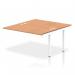 This photo showcases the sleek design of the Dynamic Bench Desking Impulse Bench B2B Ext Kit. The white frame and oak surface create a modern and clean look for any office space.