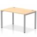 This photo captures a sleek and modern silver-framed office bench desk, featuring a single row of dynamic bench desking. The attractive maple wood surface adds warmth and sophistication to any workspace.