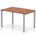 This image features a sleek silver frame bench desk with a walnut top. The single row design creates a dynamic and modern look in any office space.