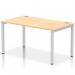 This image shows a sleek and modern single row bench desk with a metallic silver frame and a maple desktop. The design is dynamic and versatile, making it ideal for any office space.