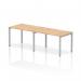 The image shows a modern and versatile Impulse Bench Single Row that can accommodate 2 people. Its sleek and sturdy silver frame pairs beautifully with the maple office bench desk, creating a dynamic and functional workspace.