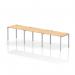 This image shows a sleek and modern single row bench desk designed for three people. The silver frame provides a dynamic aesthetic, while the maple wood finish adds warmth. This office bench desk is perfect for collaborative work environments.