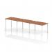 This photograph features a sleek and modern Dynamic Bench Desking Impulse Bench with a white frame and walnut desk. The single row design can accommodate up to three people, creating a dynamic workspace for any office setting.