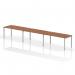 This picture shows a modern and sleek Dynamic Bench Desking Impulse Bench. It is a single row, 3-person desk with a 1600 size and a silver frame. The desk is made with a walnut wood finish, giving it a warm and elegant look. Perfect for any office setting.
