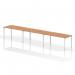 This photo shows a modern and versatile bench desk setup. The white frame offers a clean and contemporary look, while the oak tabletop adds warmth and texture. With enough space for 3 people, this bench desk is perfect for a collaborative work environment.