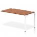 The Dynamic Bench Desking Impulse Bench Single Row Ext Kit features a sleek, white frame and a stylish walnut office bench desk. With a length of 1400mm, this bench desk is perfect for any modern office space.