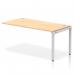 The picture shows a sleek silver-framed bench desk with a maple desktop, designed for maximum efficiency and comfort in an office setting. Its dynamic form allows for versatility and flexibility, making it a practical choice for any workspace.