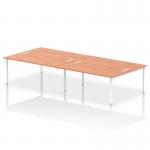 In the photograph, there is a dynamic bench desking set-up with an Impulse Bench B2B configuration. It can accommodate 4 persons and has a 1800 white frame. The office bench desk is made of beech and is labeled as IB00406.