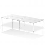 This photograph captures a modern office setting with four individuals seated at the Dynamic Bench Desking Impulse Bench B2B. The sleek white frame and 1800 width provide ample space for a productive work environment.