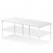 This photograph captures a modern office setting with four individuals seated at the Dynamic Bench Desking Impulse Bench B2B. The sleek white frame and 1800 width provide ample space for a productive work environment.