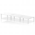 This picture shows a modern and sleek 6-person bench desk with a silver frame and white desk surface. The bench is designed for use in a bustling office, providing a dynamic and flexible space for collaboration and productivity.