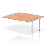 A sleek and modern photo showcasing the Dynamic Bench Desk Add On Units Impulse Bench B2B Ext Kit in a striking 1800 silver frame with a stylish and functional office bench desk in a warm beech finish. The perfect addition to any professional workspace.