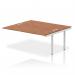 This picture shows a stunning Dynamic Bench Desk with Add On Units, featuring a sleek silver frame and a gleaming walnut surface. With its spacious design and modern aesthetic, this Impulse Bench B2B Ext Kit is perfect for any contemporary office space.