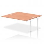 This photo showcases a sleek and modern Dynamic Bench Desk with Add On Units, Impulse Bench B2B Ext Kit, White Frame, and Beech desk surface. The clean lines and neutral color palette make it an ideal addition to any office space.