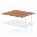 A photo of the dynamic bench desk add on units shows a sleek white frame with a rich walnut top, perfect for a modern office space. The bench desk allows for seamless collaboration and a streamlined work environment.