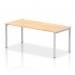 This photograph captures a sleek and modern office space featuring a dynamic bench desking set-up. The silver frame of the Impulse Bench Single Row 1800 is complemented by the maple desk top, creating a visually appealing and functional workspace.