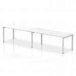 The picture shows a sleek and modern single row bench desk with a silver frame and white desktop. It can comfortably accommodate two people and is perfect for creating a dynamic and efficient workspace in any office. It is the perfect combination of style and functionality.