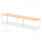 This photo features a sleek, modern Dynamic Bench Desking Impulse Bench. The single row design comfortably accommodates two people and boasts a 1800 white frame and a maple office bench desk. The neutral color scheme adds a touch of sophistication to any workspace.