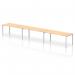 In this photograph, we see a stylish and modern Dynamic Bench Desking Impulse Bench. It features a single row, with enough space for 3 people, all sitting comfortably at the 1800 Silver Frame Office Bench Desk. The desk is finished in a beautiful Maple color, creating a clean and professional look.